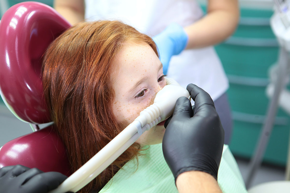 Little,Girl,Is,Injected,With,An,Inhalation,Sedative,During,Dental